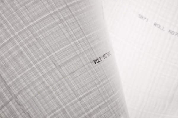 Close-up of a UHMWPE fabric with  branding on a background